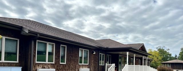 The cedar-clad exterior of Rising Phoenix's retreat lodge